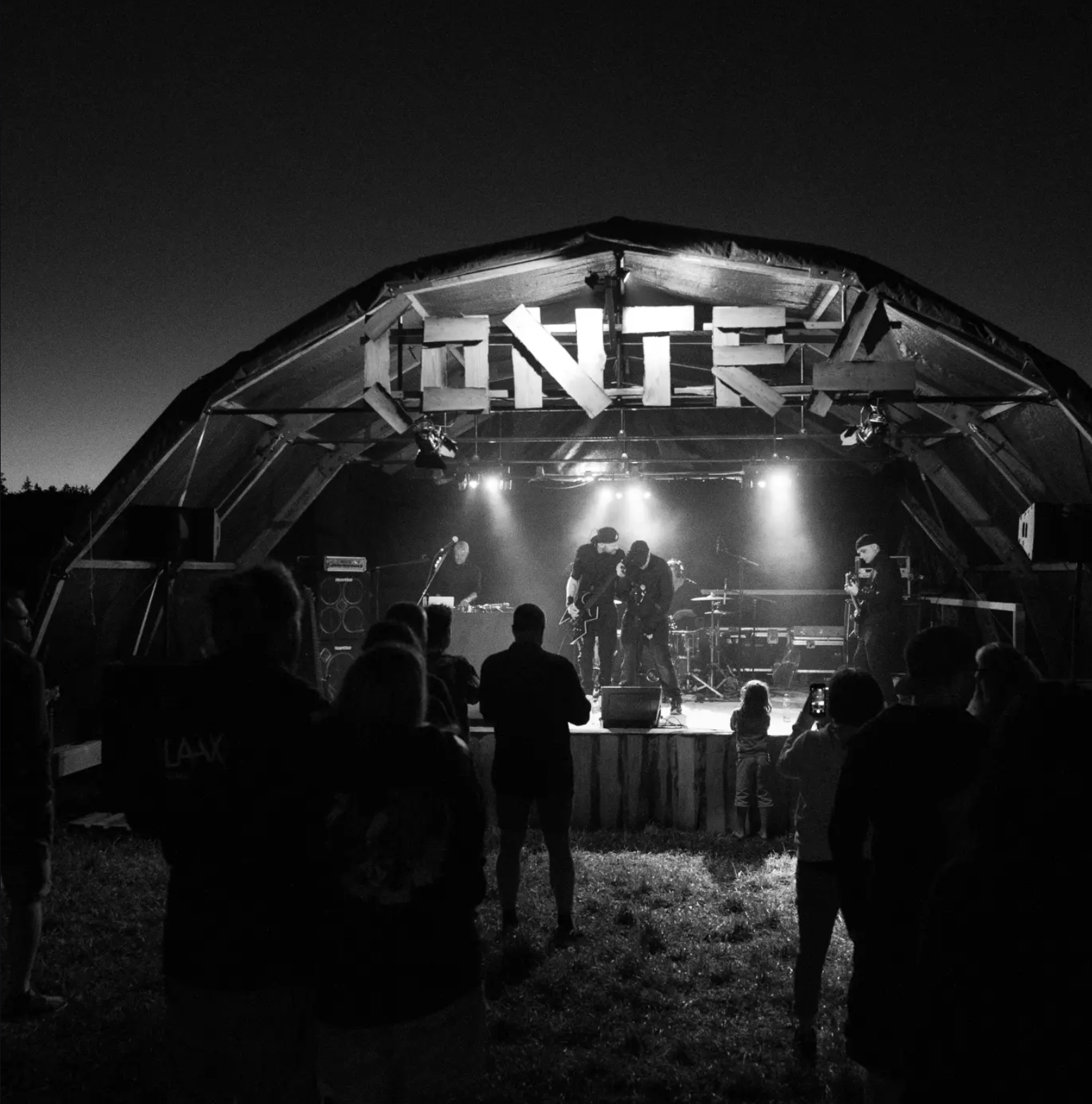 BROOK performing live outdoors at night